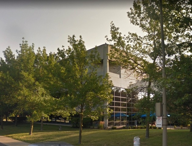 It's hard to get a good shot of the building with so many trees.